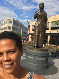 Arvette M. Reid in front of Aunt Maggie's statue in Richmond, VA